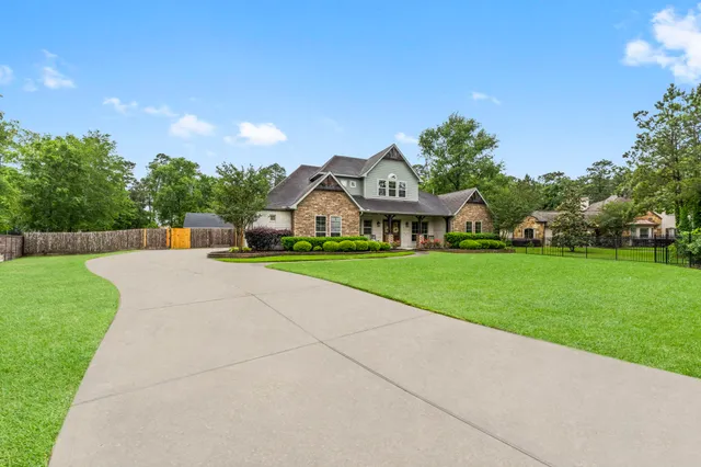 a view of yard with house and car parked