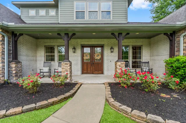 a front view of a house with a porch
