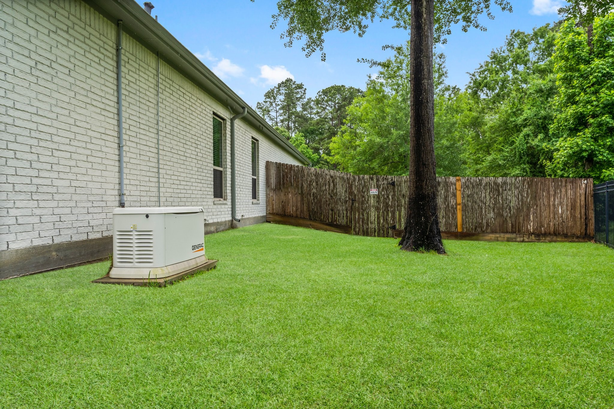 5006 Newport Court Spring, TX 77386 - Photo 10 of 46 a view of a backyard with a cabin