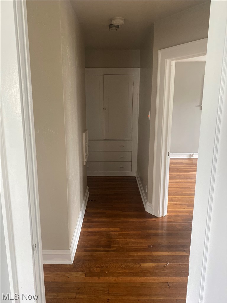 4688 Rockwood Road Cleveland, OH 44125 - Photo 25 of 35 Hallway with dark hardwood floors