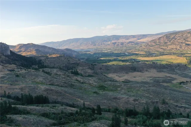 a view of a city with mountains in the background