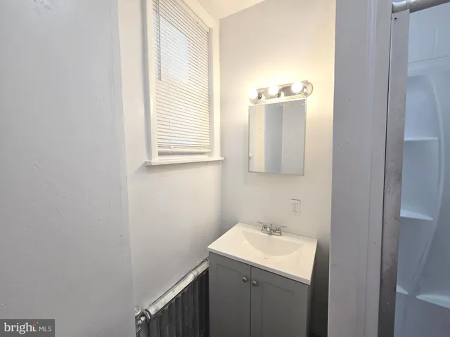 a bathroom with a tub and shower