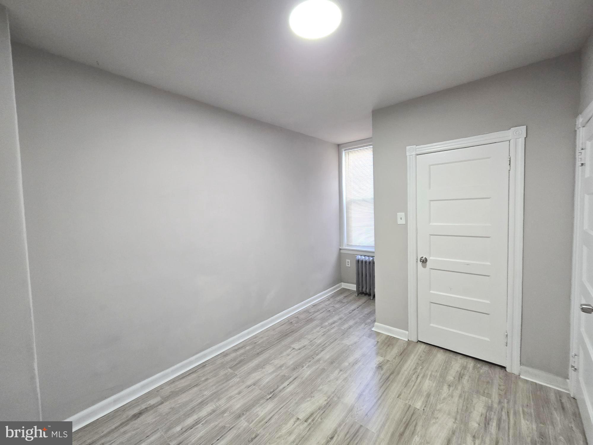 5140 North Fairhill Street Philadelphia, PA 19120 - Photo 16 of 24 wooden floor in an empty room