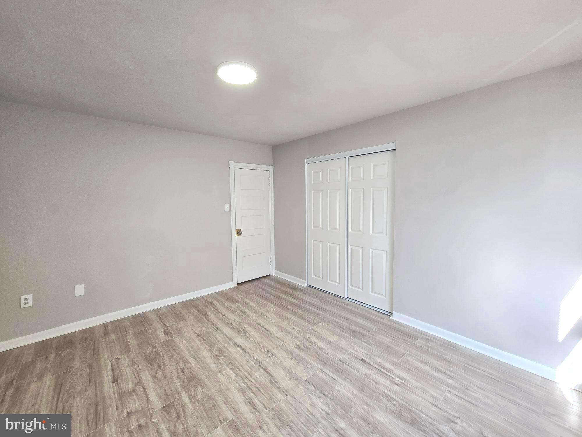5140 North Fairhill Street Philadelphia, PA 19120 - Photo 22 of 24 a view of an empty room with wooden floor