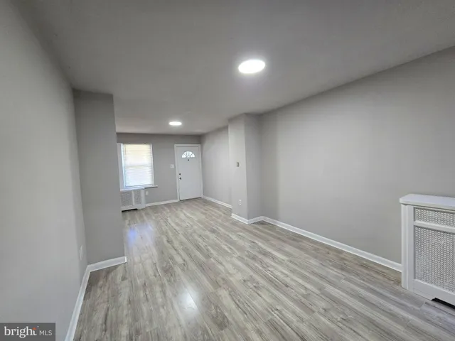 a kitchen with granite countertop a stove and a sink