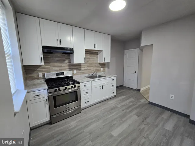 a front view of a house with glass windows