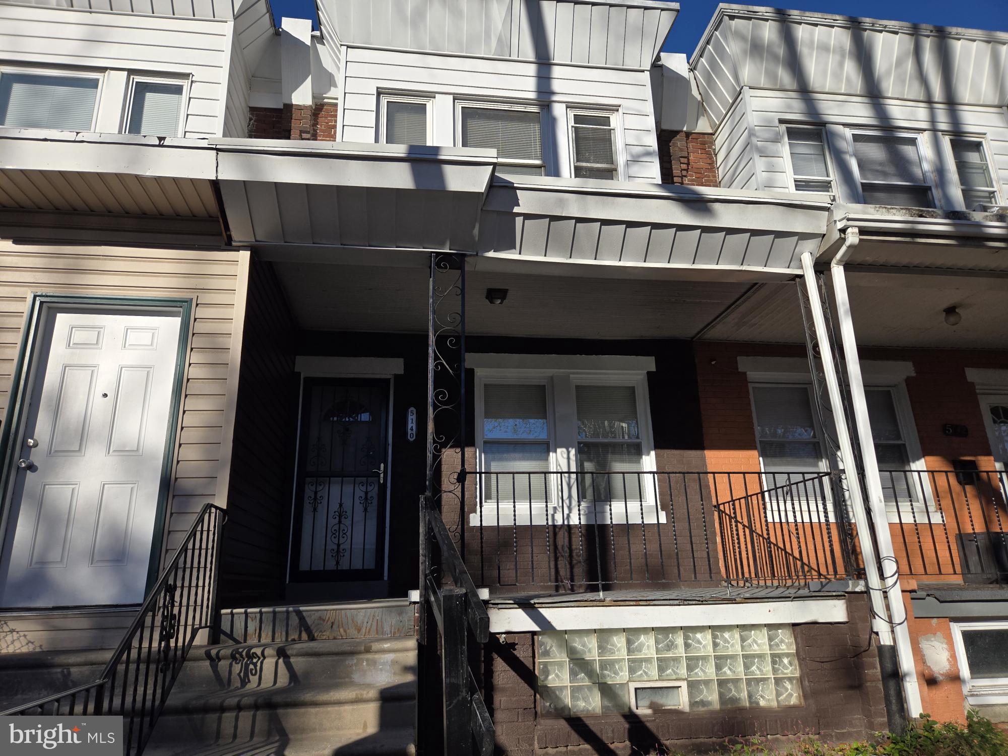 5140 North Fairhill Street Philadelphia, PA 19120 - Photo 8 of 24 a front view of a house with glass windows