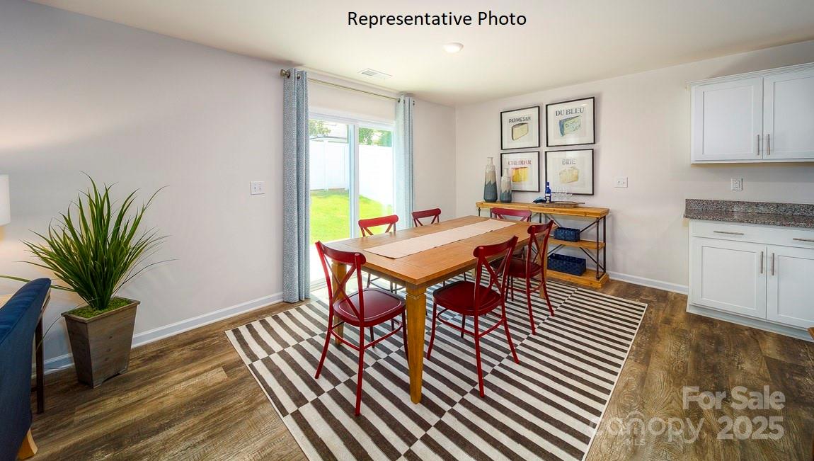 1410 Mammoth Road Hickory, NC 28602 - Photo 13 of 34 a view of a dining room with furniture window and wooden floor