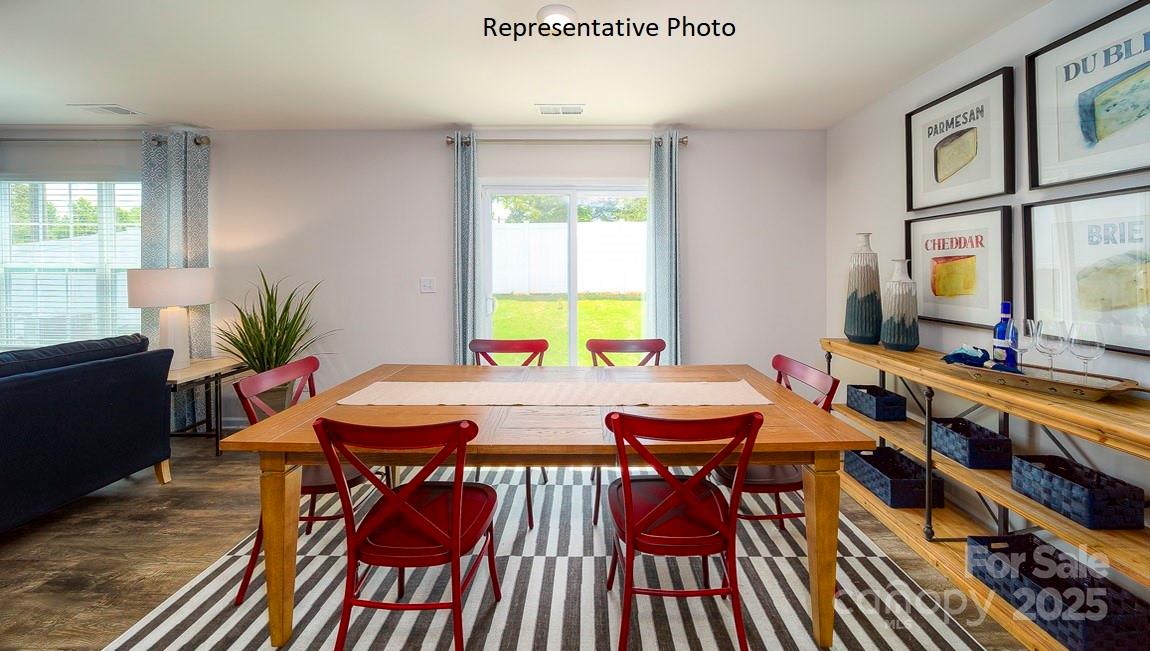 1410 Mammoth Road Hickory, NC 28602 - Photo 14 of 34 a view of a dining room with furniture window and wooden floor