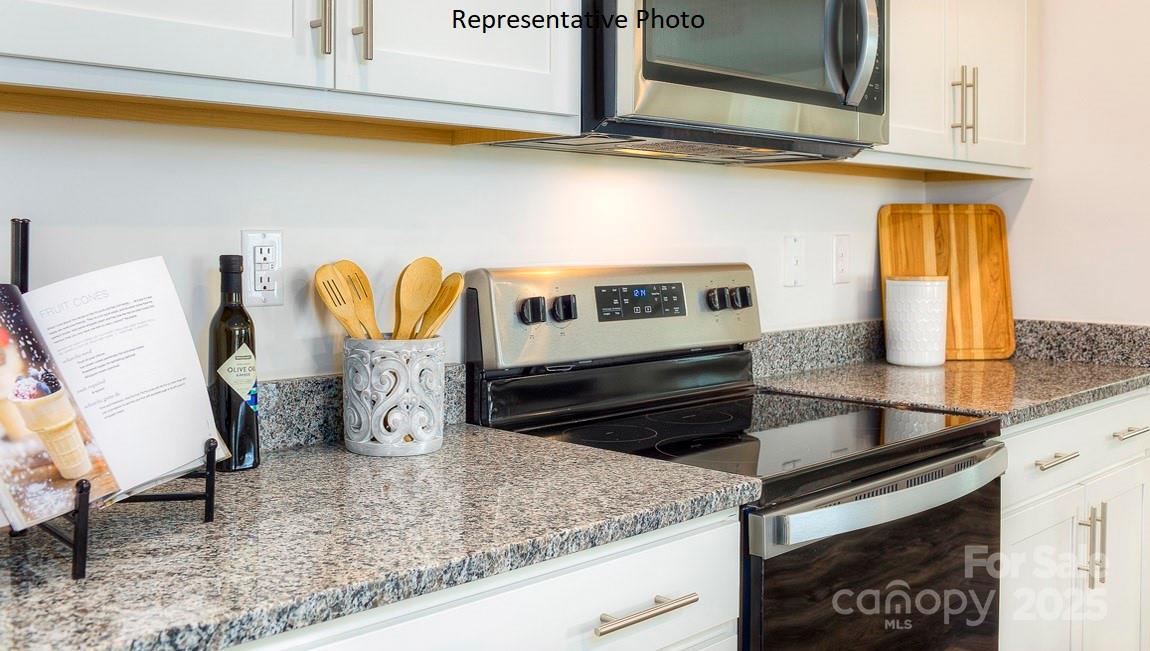 1410 Mammoth Road Hickory, NC 28602 - Photo 7 of 34 a kitchen with granite countertop a sink and a stove