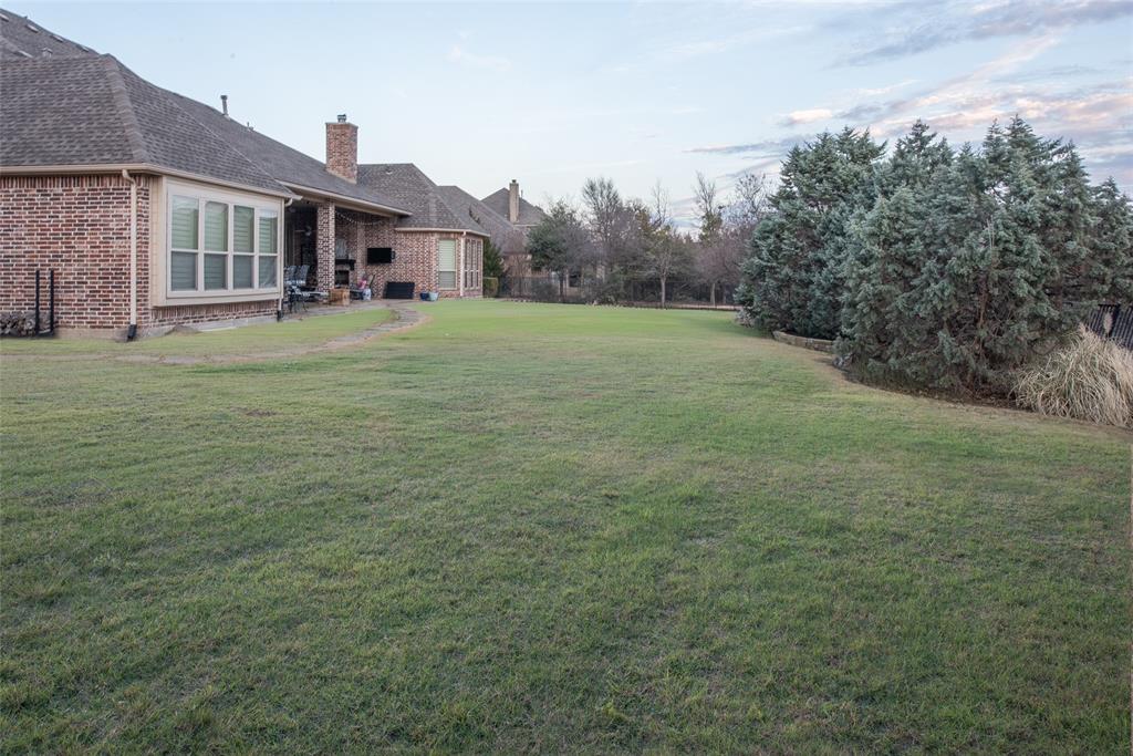 811 Red Store Court Lucas, TX 75002 - Photo 28 of 31 a view of a big room with a big yard and large trees