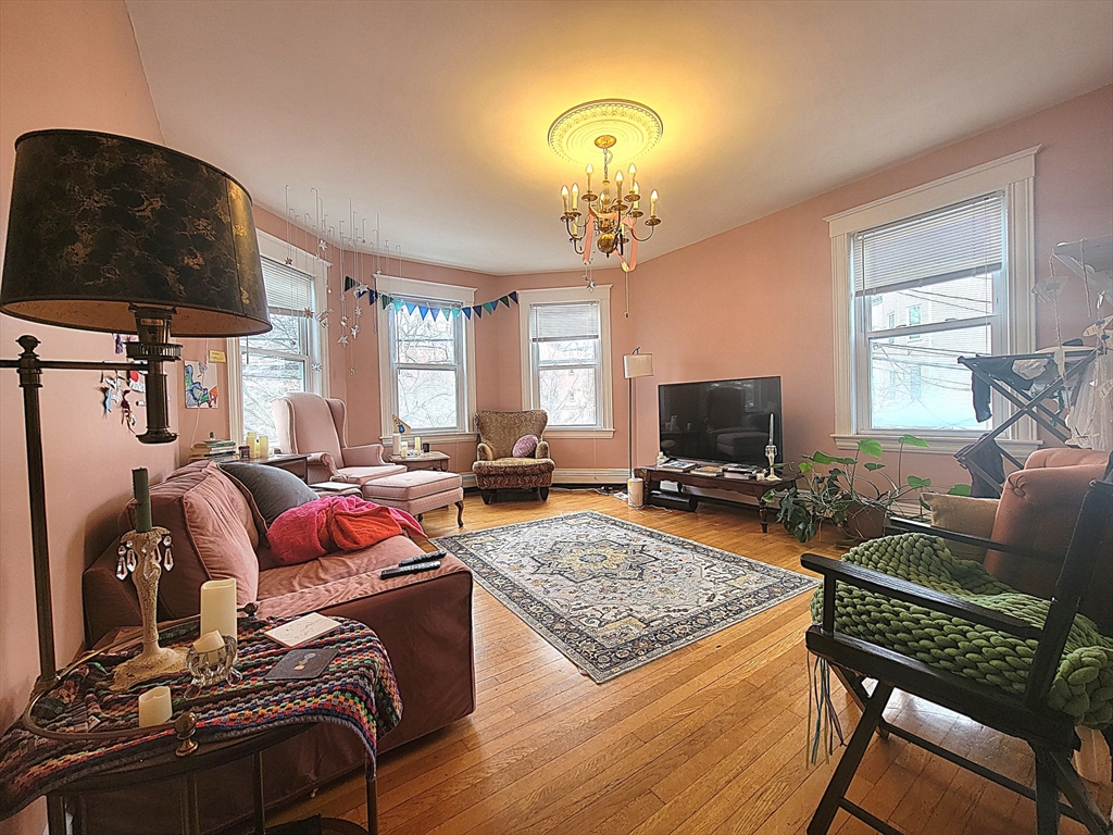 a living room with furniture and a flat screen tv