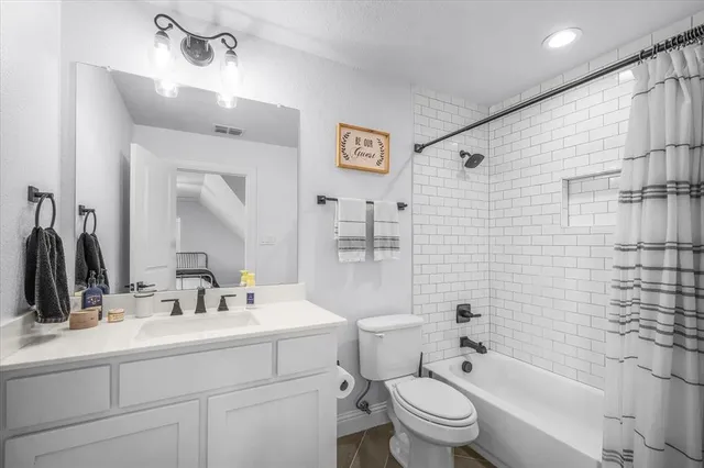 a view of a house with swimming pool and furniture