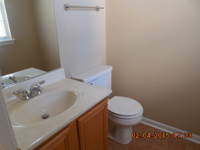 17867 Braewick Road Gurnee, IL 60031 - Photo 15 of 19 a bathroom with a sink and a toilet