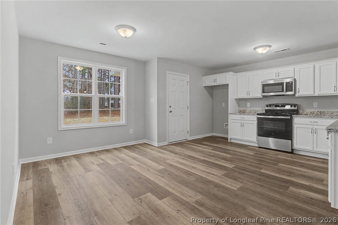 402 Rutherford Street Spring Lake, NC 28390 - Photo 11 of 34 a view of kitchen with sink microwave and stove