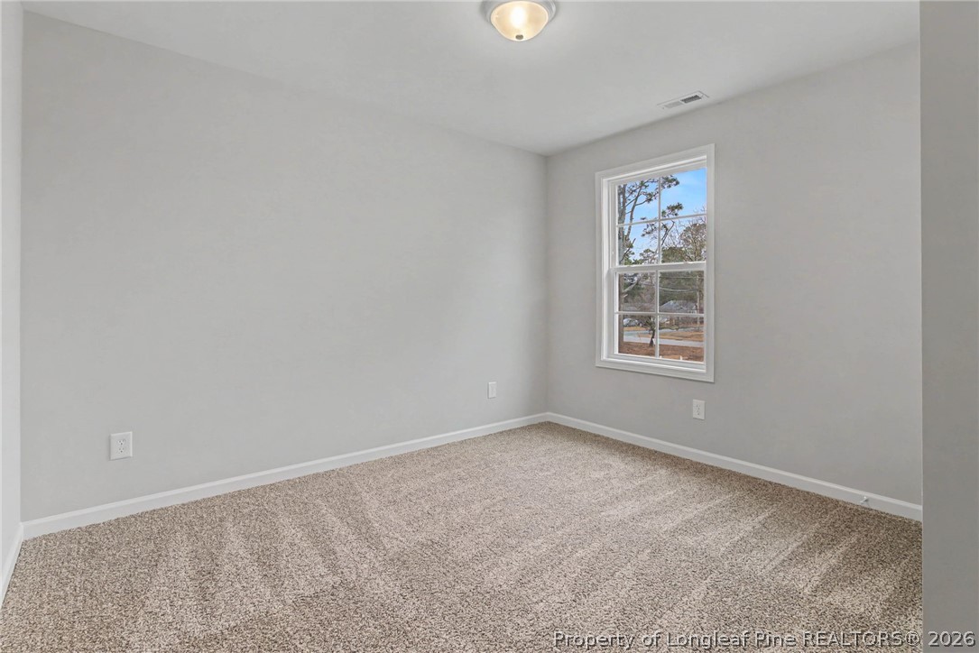 402 Rutherford Street Spring Lake, NC 28390 - Photo 24 of 34 an empty room with windows
