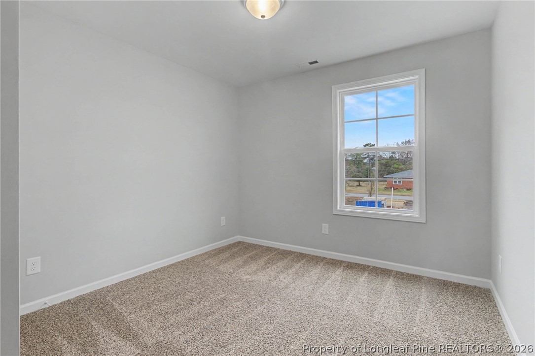 402 Rutherford Street Spring Lake, NC 28390 - Photo 26 of 34 an empty room with a window