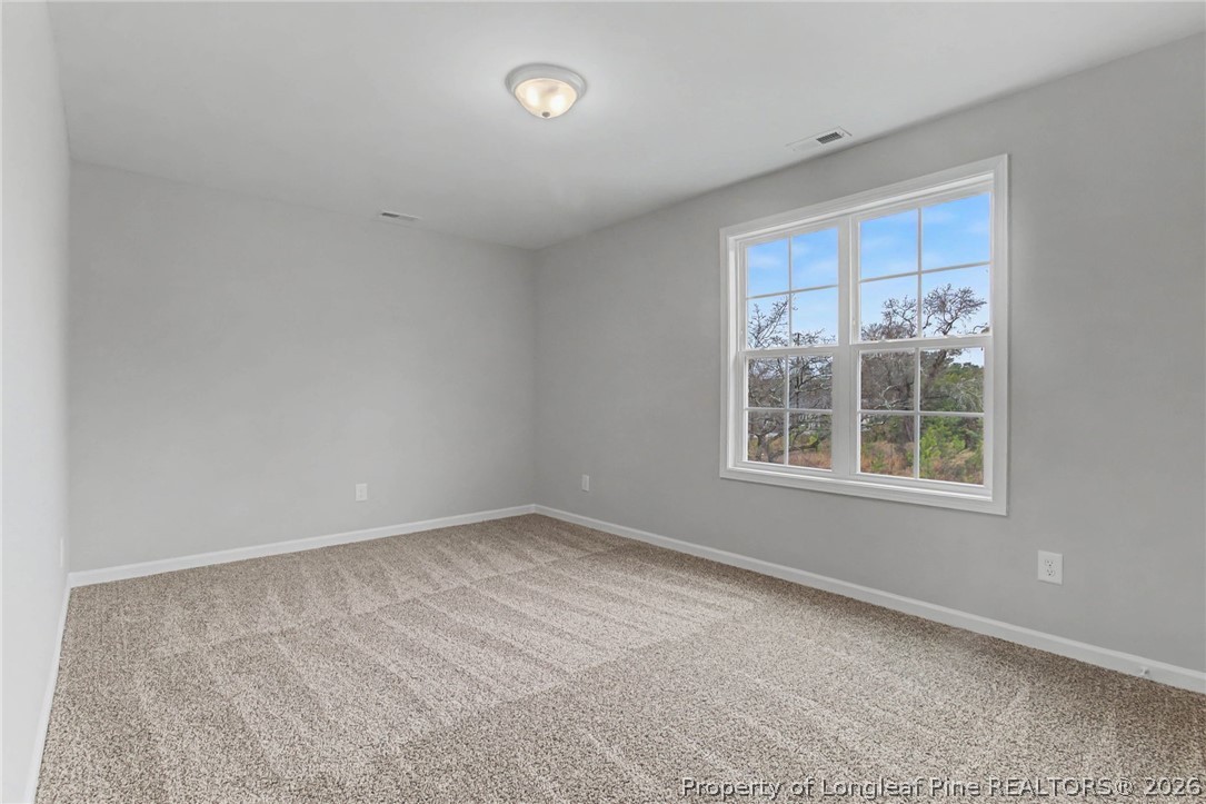 402 Rutherford Street Spring Lake, NC 28390 - Photo 28 of 34 an empty room with a window