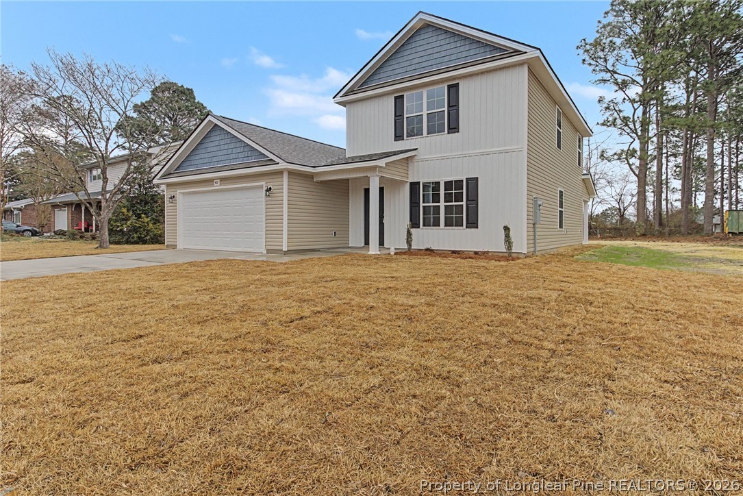 402 Rutherford Street Spring Lake, NC 28390 - Photo 3 of 34 a front view of house with yard and trees around