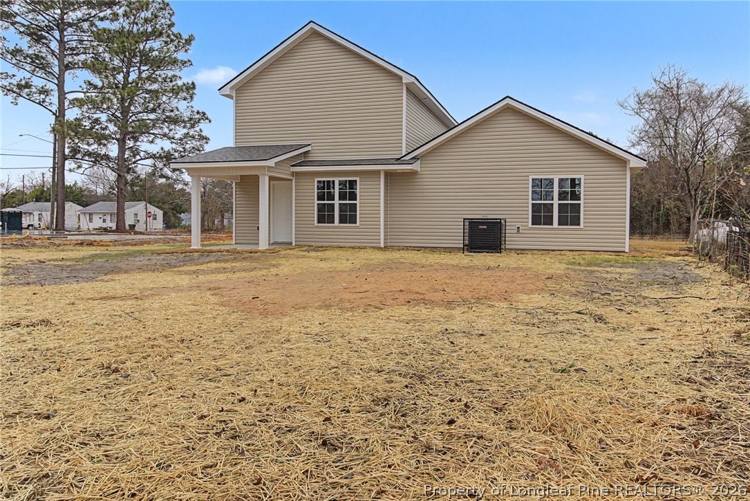 402 Rutherford Street Spring Lake, NC 28390 - Photo 32 of 34 a view of a house with a yard
