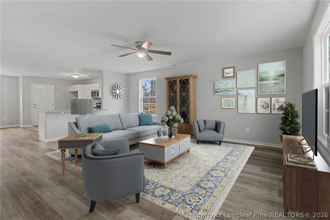 402 Rutherford Street Spring Lake, NC 28390 - Photo 4 of 34 a living room with furniture and a flat screen tv