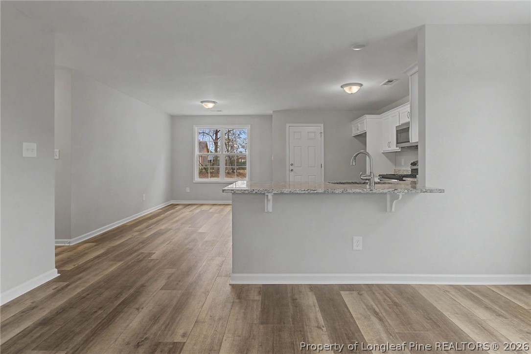 402 Rutherford Street Spring Lake, NC 28390 - Photo 8 of 34 a view of kitchen and front door