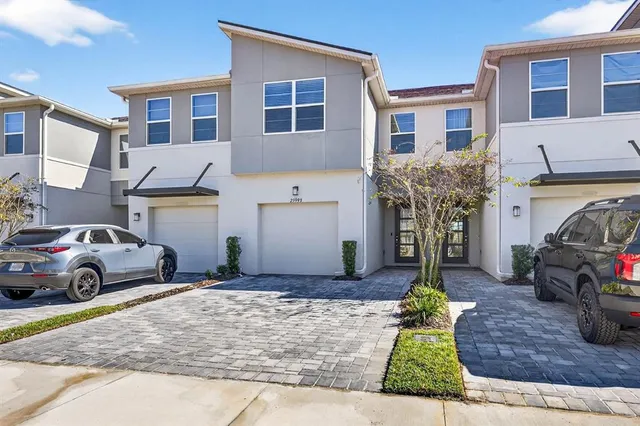 a view of a car park in front of a house