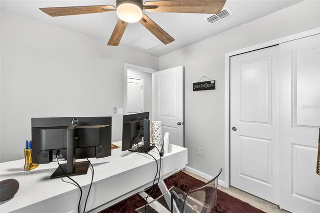 a view of a livingroom with furniture and a flat screen tv