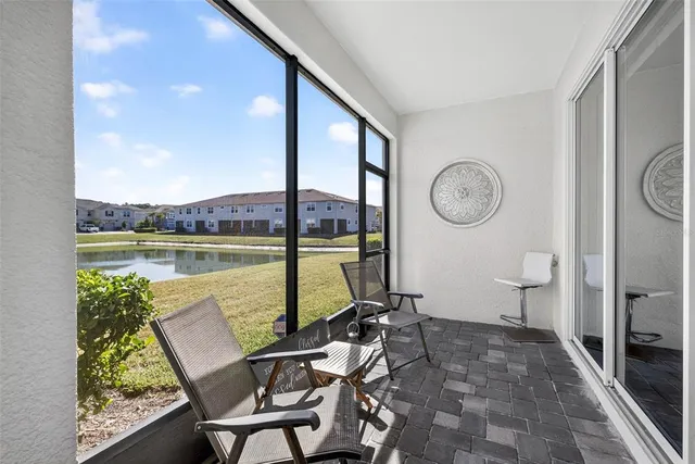 a view of a floor to ceiling window and wooden floor