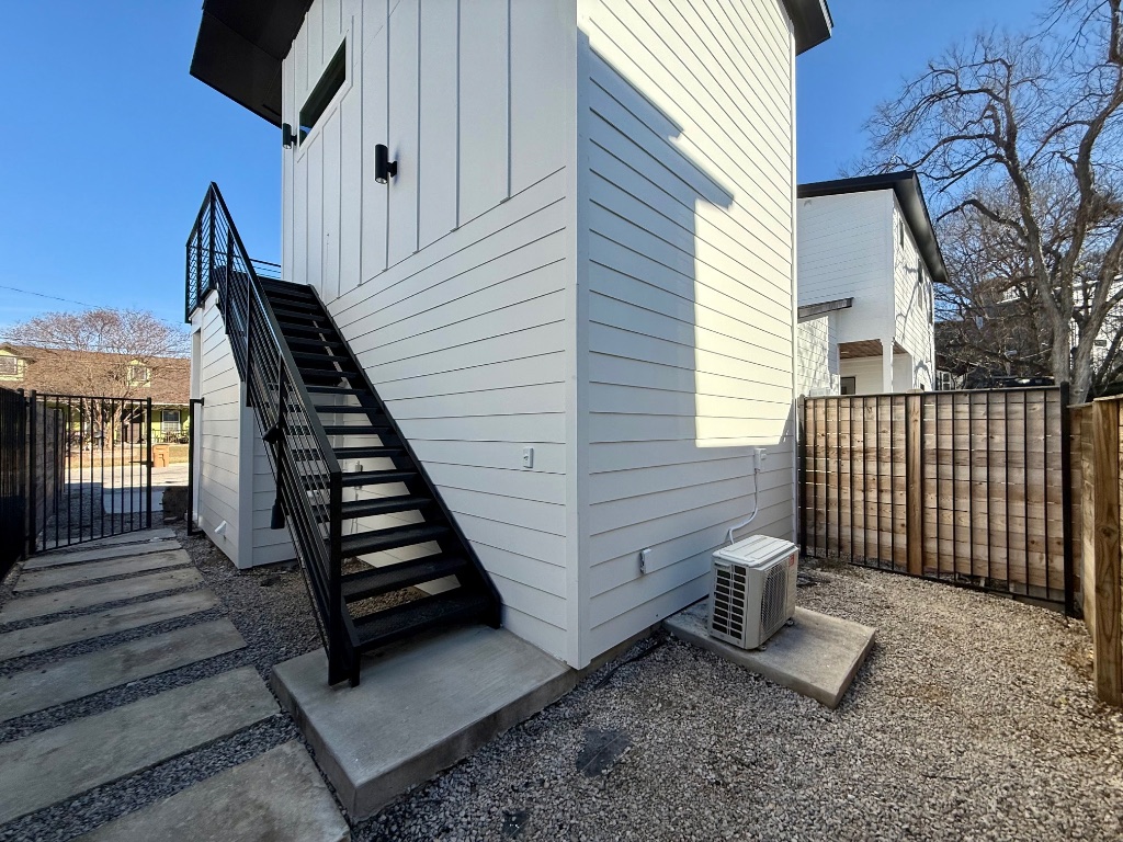 3919 East 16th Street, Unit 1 Austin, TX 78721 - Photo 11 of 11 a view of a deck with wooden floor and fence