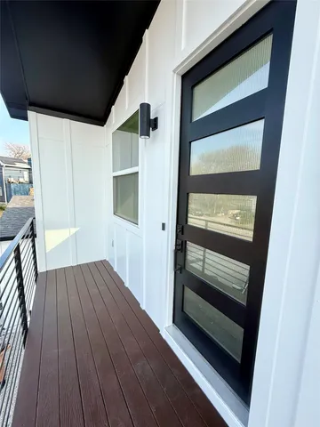 a view of front door with wooden floor