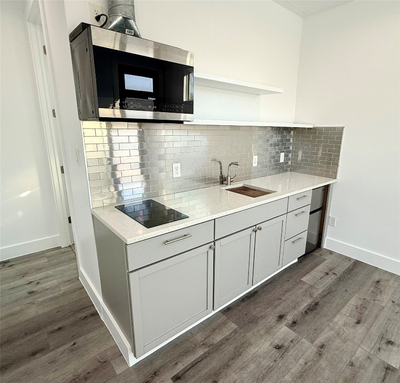 3919 East 16th Street, Unit 1 Austin, TX 78721 - Photo 8 of 11 a kitchen with a sink and a microwave