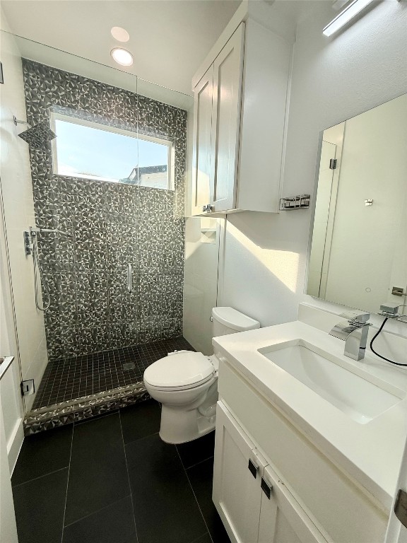 3919 East 16th Street, Unit 1 Austin, TX 78721 - Photo 9 of 11 a bathroom with a sink toilet and shower