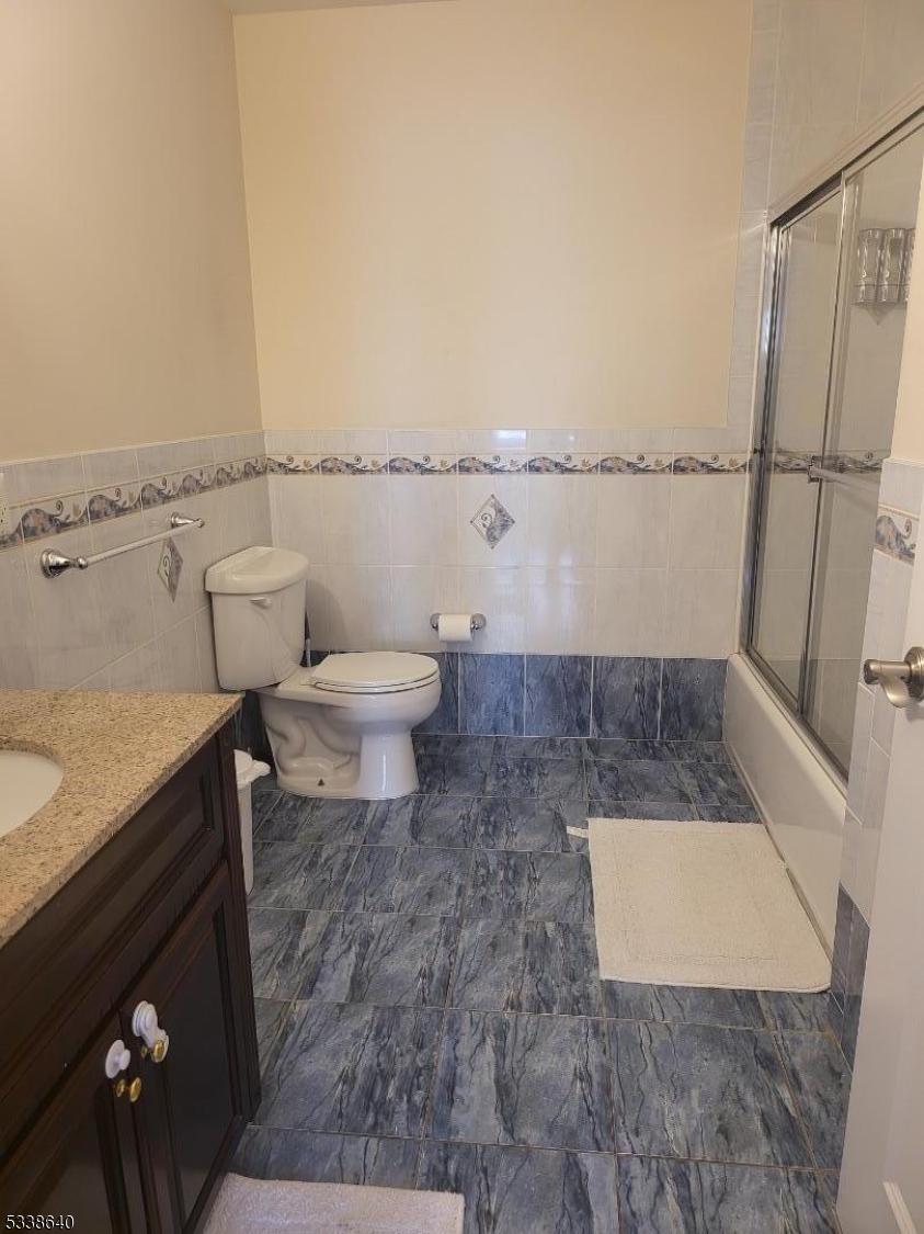 115 Ferry Street, Unit 3A Newark, NJ 07105 - Photo 7 of 10 a bathroom with a toilet and a shower