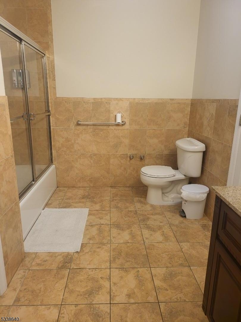 115 Ferry Street, Unit 3A Newark, NJ 07105 - Photo 9 of 10 a bathroom with a toilet and a shower
