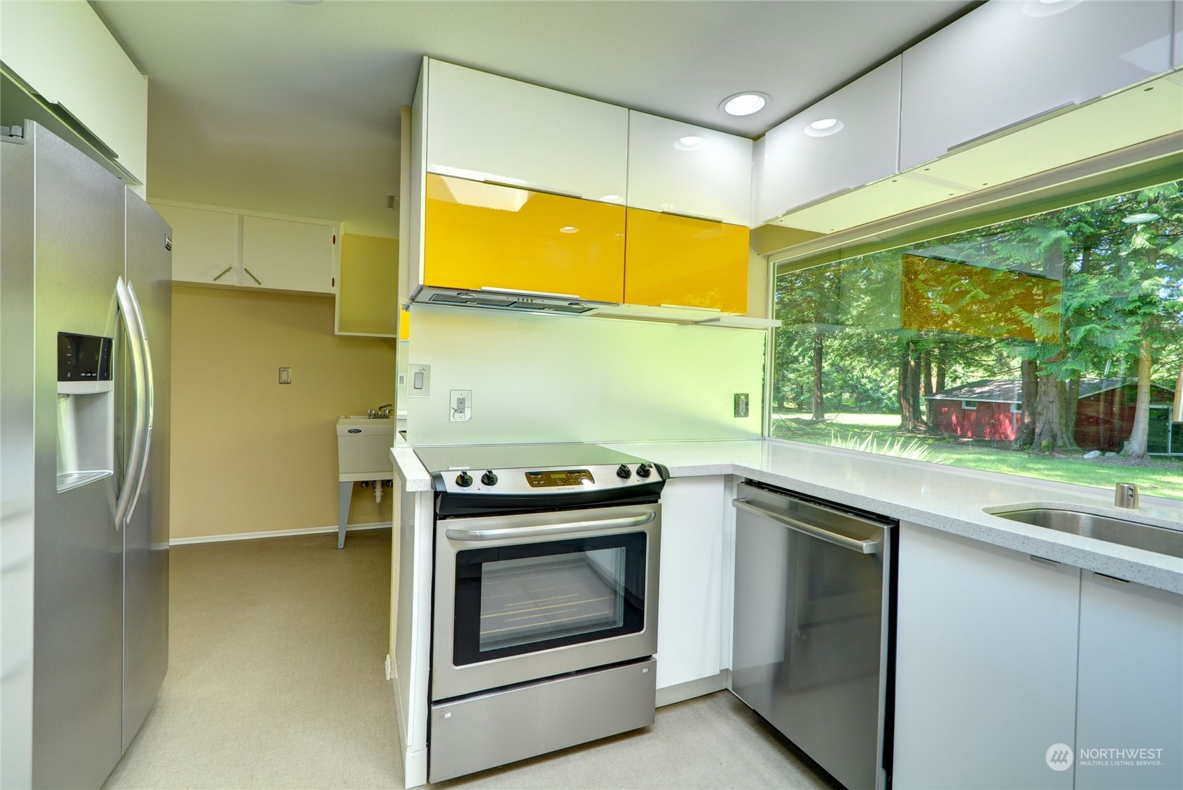 4608 Strumme Road Bothell, WA 98012 - Photo 11 of 30 a kitchen with a stove and a sink