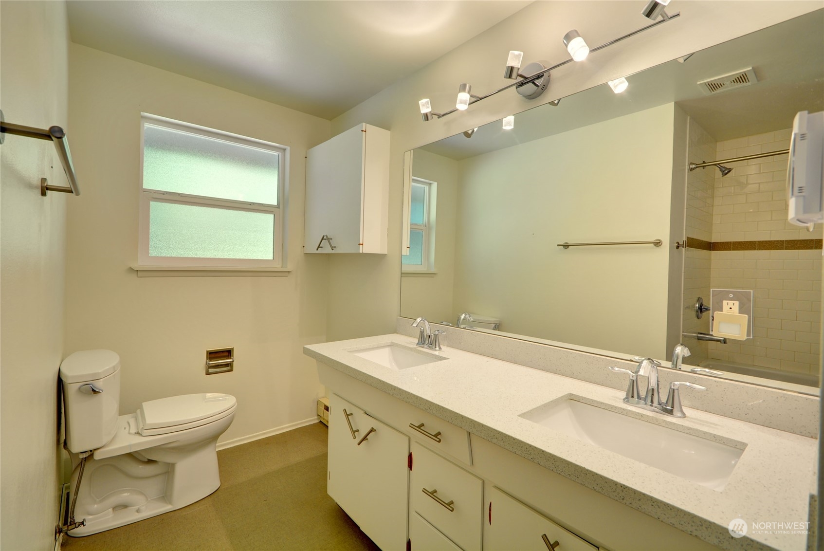 4608 Strumme Road Bothell, WA 98012 - Photo 14 of 30 a bathroom with a granite countertop sink mirror and toilet