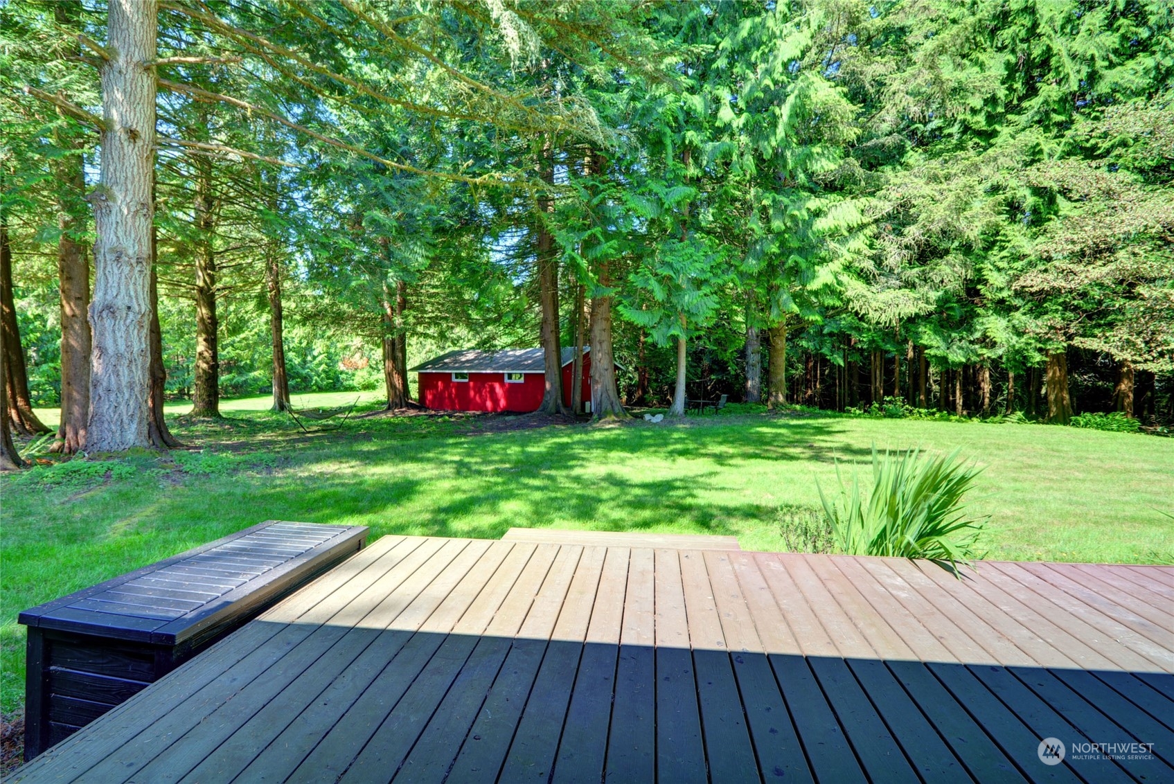 4608 Strumme Road Bothell, WA 98012 - Photo 23 of 30 a view of a backyard with wooden floor and fence
