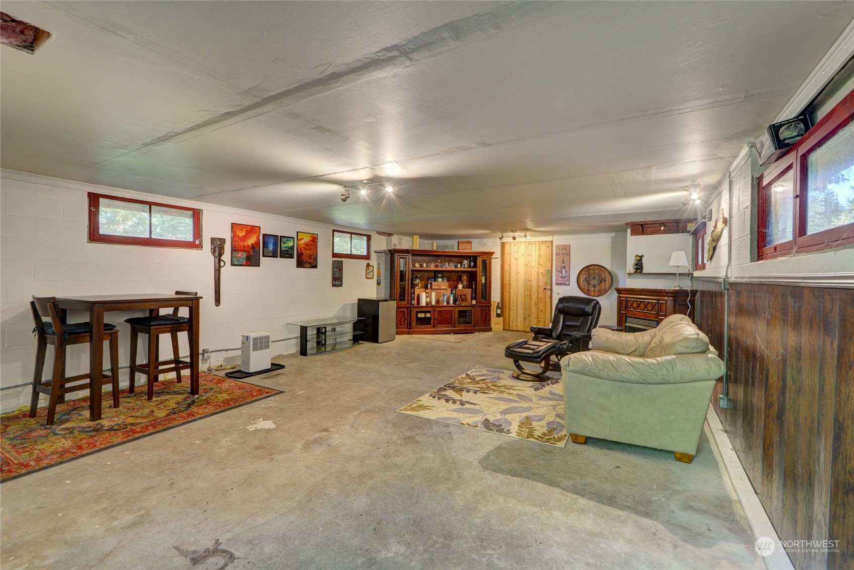 4608 Strumme Road Bothell, WA 98012 - Photo 26 of 30 a bedroom with furniture and a flat screen tv