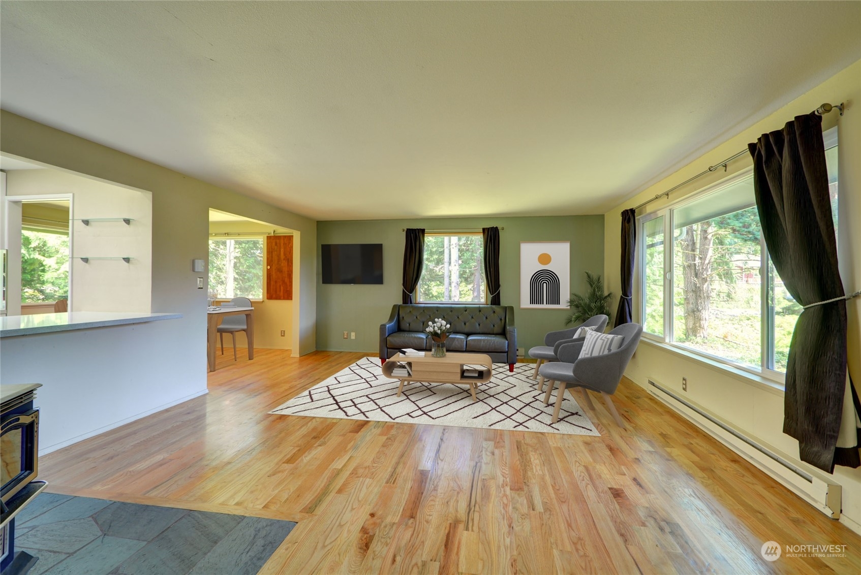 4608 Strumme Road Bothell, WA 98012 - Photo 7 of 30 a living room with furniture and a flat screen tv