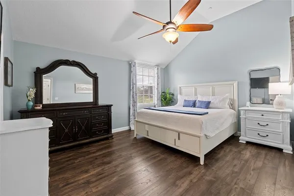 a bedroom with a bed and a dresser