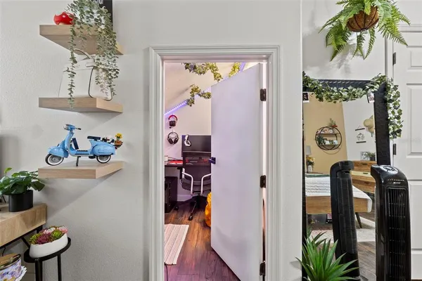 a view of hallway that has closet