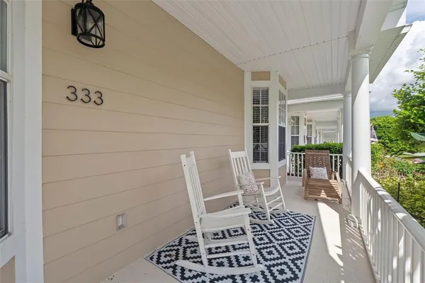 a view of balcony with furniture