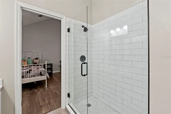 a bathroom with a bath tub and shower