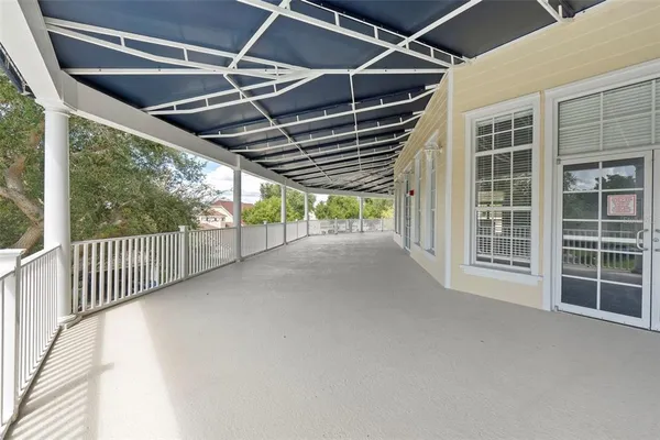 a view of porch with wooden floor