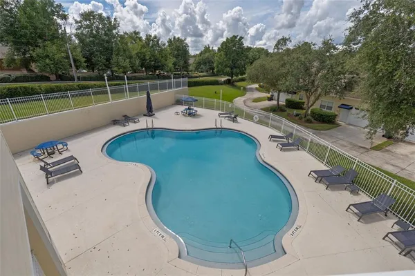 a view of a swimming pool with a patio