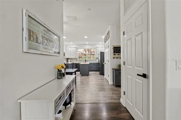 a kitchen with stainless steel appliances refrigerator oven and cabinets