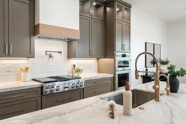 a view of storage and utility room with wooden floor