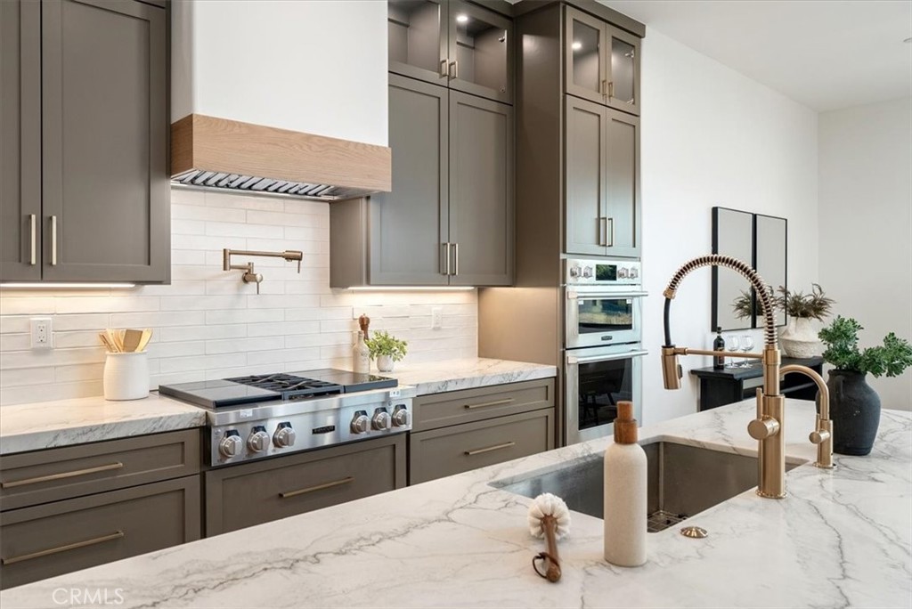 1410 Fire Rock Loop Templeton, CA 93465 - Photo 14 of 64 a kitchen with a stove a sink and a refrigerator