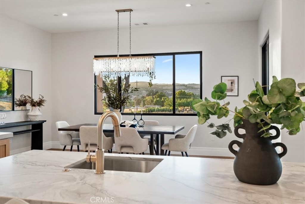 1410 Fire Rock Loop Templeton, CA 93465 - Photo 20 of 64 a living room with furniture potted plant and a large window